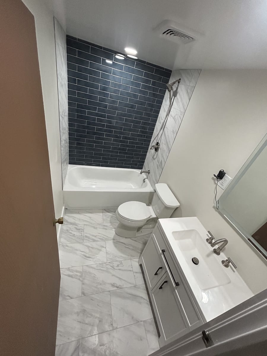 Bath Remodel · Marble & Navy — photo 1